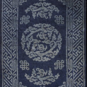 Rectangular navy rug with medium pile, featuring intricate gray-blue geometric borders and cloud designs.