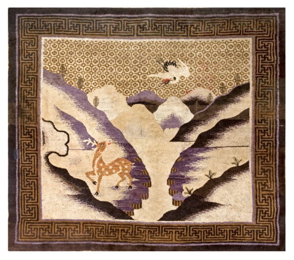 Beige and purple high pile square rug with a pictorial landscape of a deer and crane, bordered by a dark fret pattern.