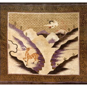 High-pile rug featuring a deer and crane in a tan and mauve landscape with a dark brown geometric border.