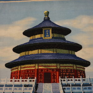 Rug featuring a tiered red and gold structure with a blue roof, set against a pale blue cloudy sky.