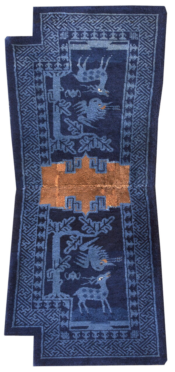 Dark blue runner rug featuring medium blue deer, birds, and trees with a central copper geometric design.