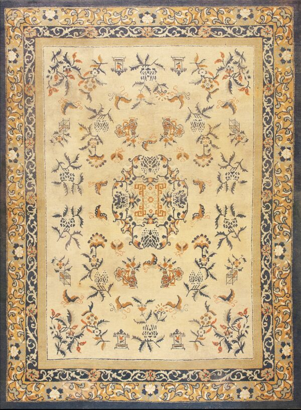 Cream rug featuring navy and ochre floral designs surrounded by a multi-layered scrolling border.