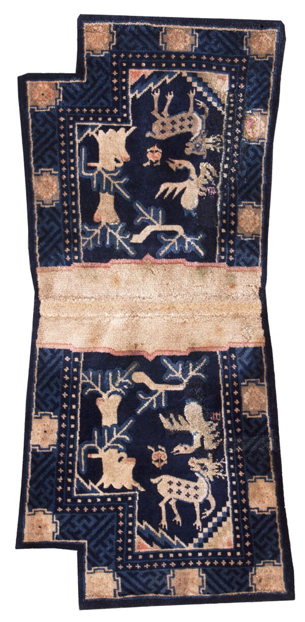 Deep navy rug runner featuring stylized tan wildlife panels, geometric borders, and a prominent horizontal beige band.