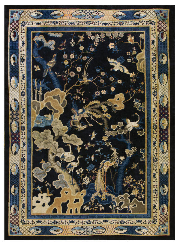 The black field of this rug holds a detailed gold and blue pattern of birds, trees, and landscape motifs.