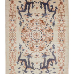 Cream rug featuring symmetrical blue dragon and brown phoenix motifs with floral and geometric borders.