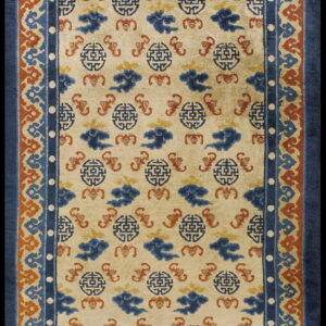Beige rug with repeating blue medallion and cloud patterns, framed by a multi-layered blue and rust border.