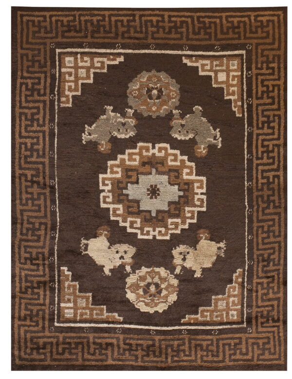 Dark brown rug featuring a geometric meander border surrounding central medallions and stylized light tan animals.
