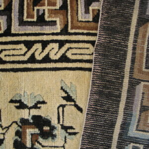 Beige pile rug with black, brown, and blue floral and key patterns beside a tightly woven dark geometric texture.