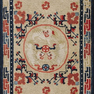 Beige runner rug with three stylized medallions, red and blue floral accents, and a dark blue geometric border.