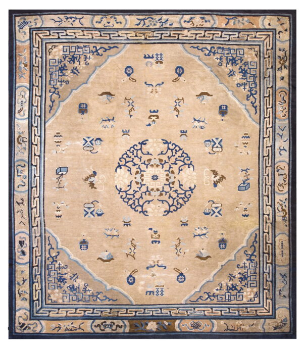 Beige traditional rug featuring a navy blue medallion, scattered motifs, and complex multi-layered borders.