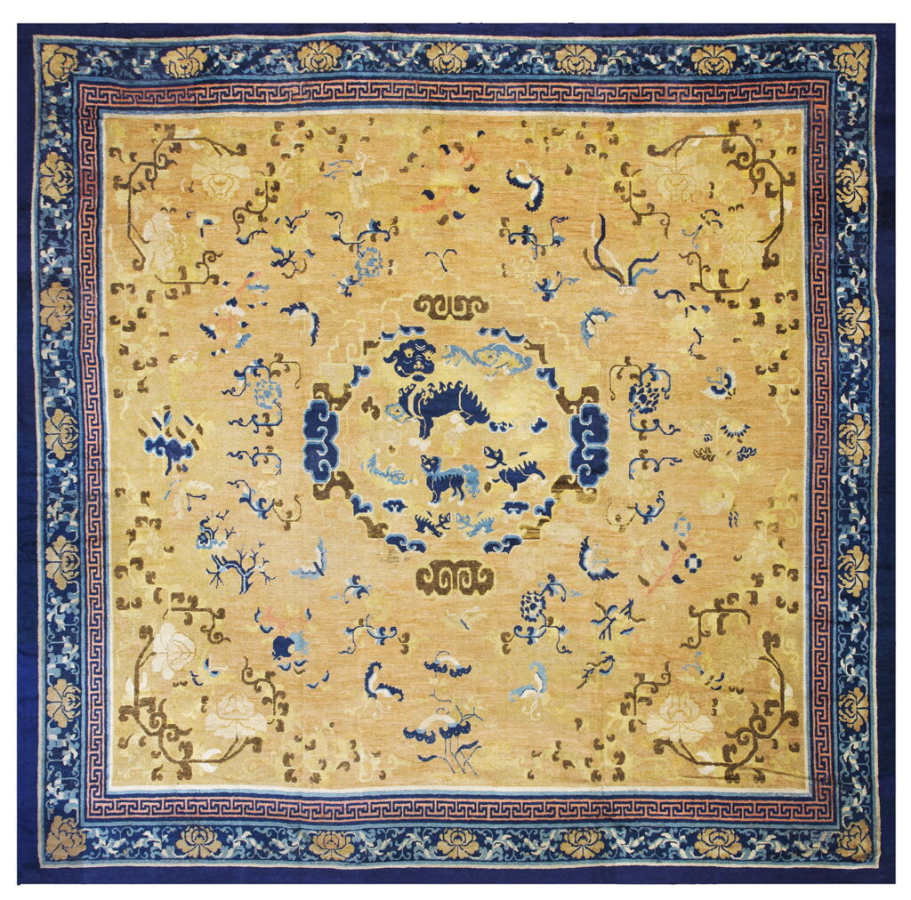 Antique ningxia carpets: a collector's guide to early chinese carpets 2 Square oriental style rug featuring a golden yellow field, navy border, and central dark blue stylized animal designs.