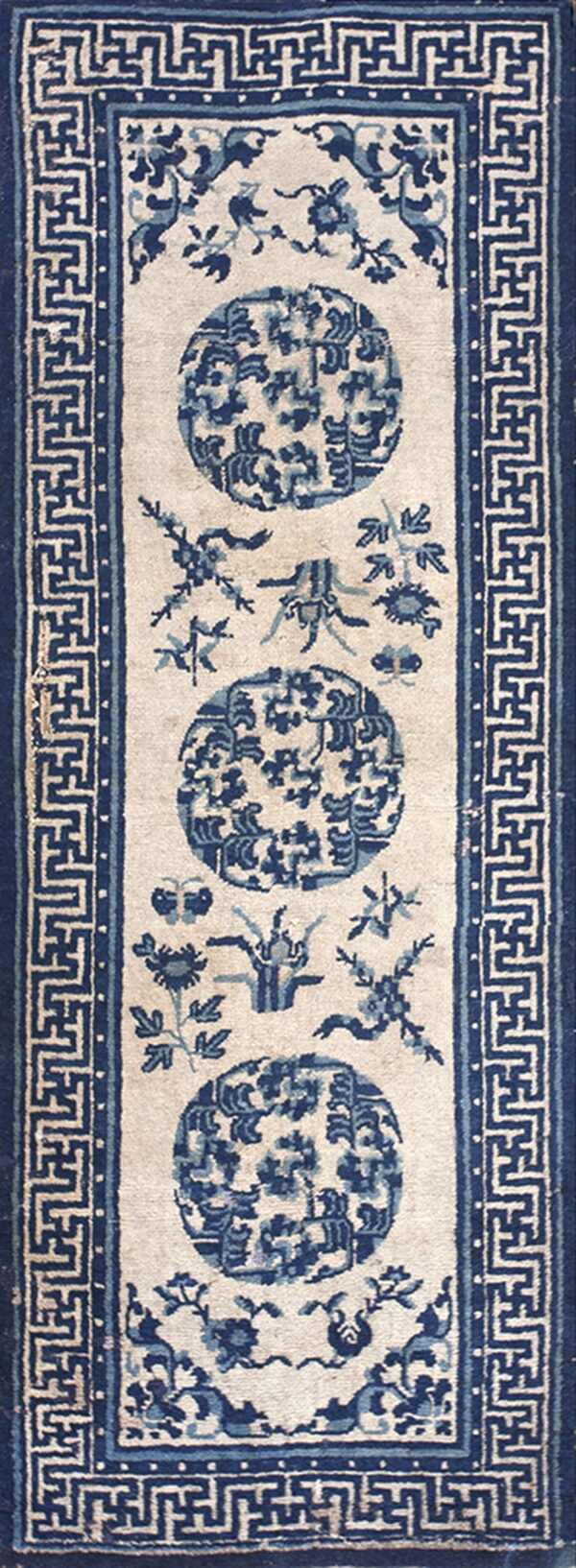 Blue and cream runner rug featuring three circular medallions and a wide geometric fret border.