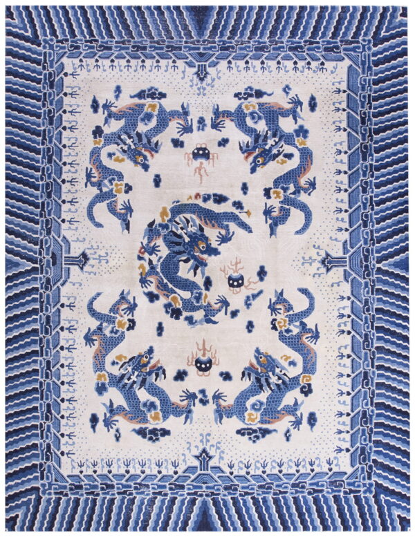 Overhead view of a white rug patterned with stylized blue dragons and a wide blue geometric border.