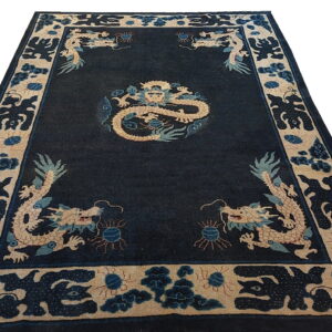 Dark blue rug with beige and light blue dragon and cloud motifs, displayed against a white background.