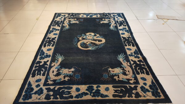 Antique chinese - ningxia hallway runner wool blue rug 2 Rectangular dark blue rug featuring beige and pale blue dragons on light tiled floor.