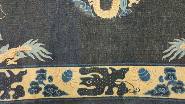 Antique chinese - ningxia hallway runner wool blue rug 4 Dark blue patterned rug showing a tan dragon detail and a wide tan border with blue motifs.