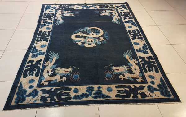 Antique chinese - ningxia hallway runner wool blue rug 7 Indigo field rug with white and pale blue dragons and border patterns on beige tiled flooring.