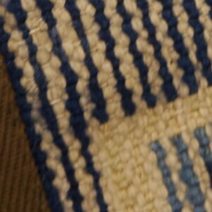 Three adjacent fabric panels show dark brown, blue and yellow shag texture, and striped flatweave.