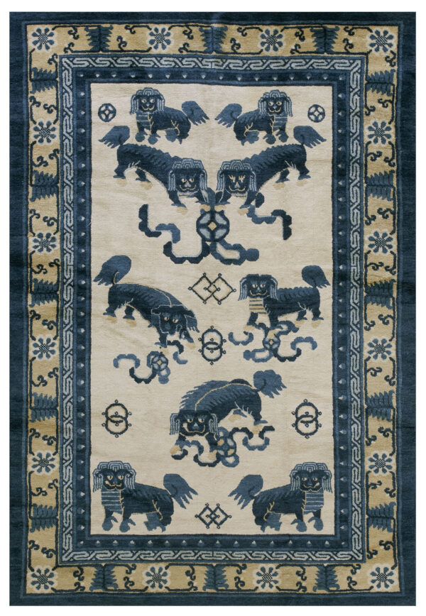 Blue mythological lions and knotwork pattern on a cream field with elaborate tan and navy borders.