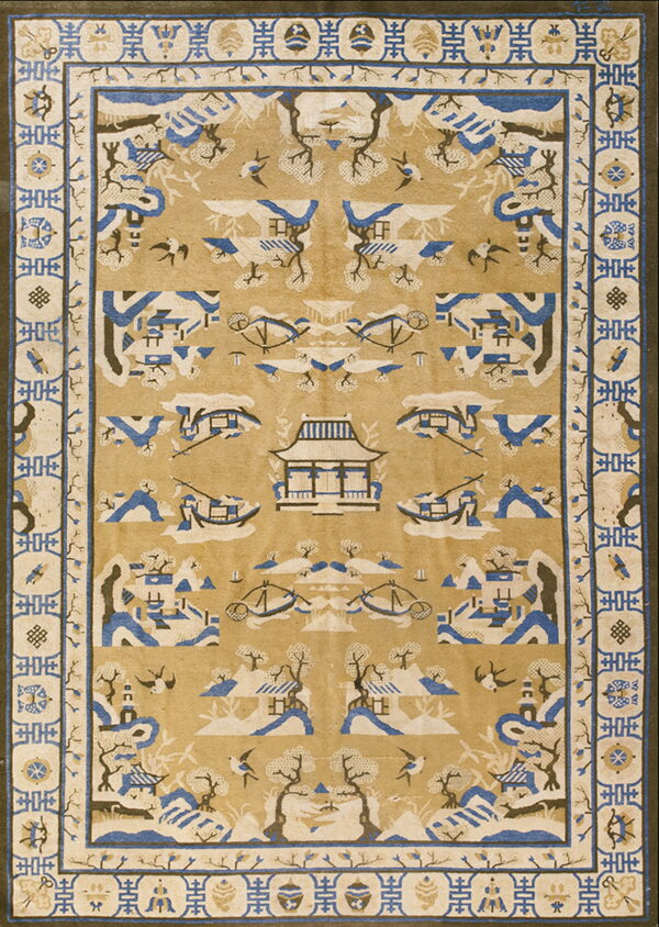 Golden tan rug with a detailed blue and cream chinoiserie pattern of pagodas, mountains, and flying birds.