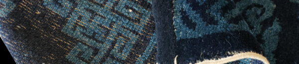 Blue rug texture detail showing dense high pile next to a woven pattern with gold accents.