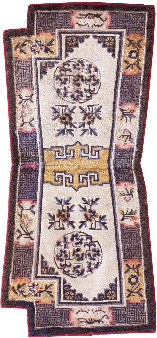 Stylized cream runner with dark borders, large floral medallions, and a central gold fretwork motif.