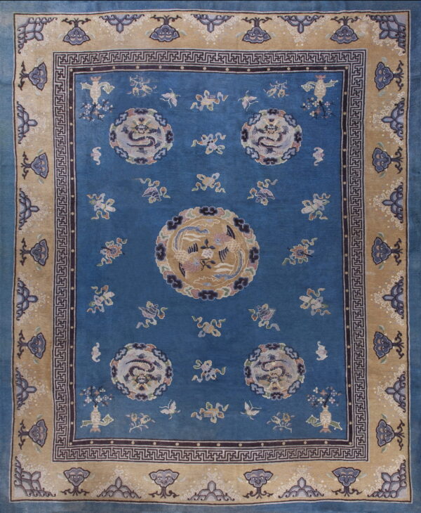 Deep blue rug with tan border featuring circular dragon medallions and geometric key designs.