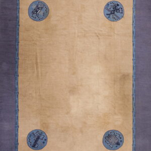 Tan rug with a wide purple border, blue bamboo framing, and four corner medallions with intricate blue patterns.