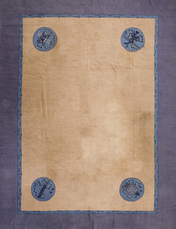 Tan rug with a wide purple border, blue bamboo framing, and four corner medallions with intricate blue patterns.