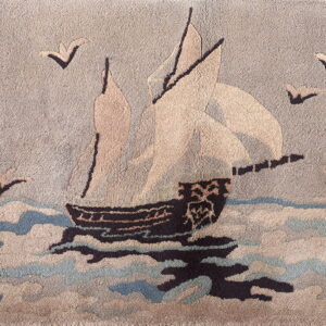 Textured pictorial rug with a sailing ship, birds, and waves in neutral taupe, dark brown, and light blue.