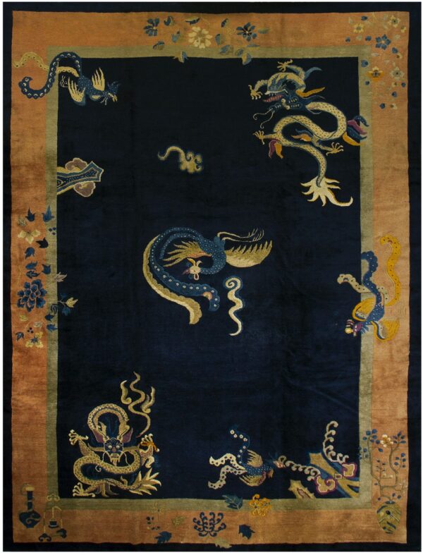 A dark navy plush rug features gold and blue dragons and phoenixes within a wide copper border.