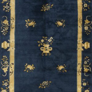 Deep blue rug featuring gold floral clusters and a thick ornamental border with vases.