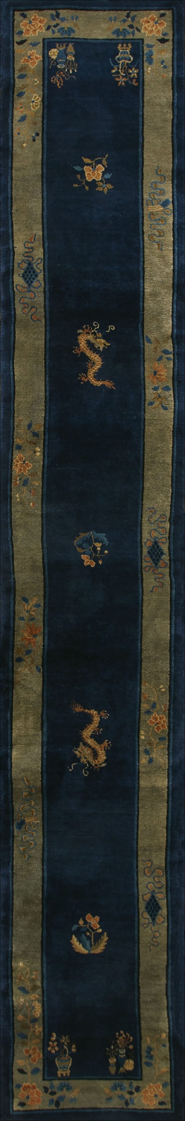 Antique chinese navy hallway runner rug features gold dragon motifs and blue florals centered between wide olive green borders.