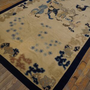 Cream and blue pictorial rug featuring figures and scrolls, centered on distressed wood floor.
