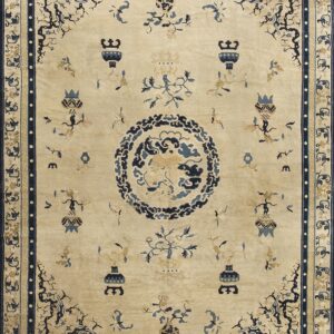 Light beige rug featuring a detailed dark blue medallion, scattered vase motifs, and thick ornate borders.