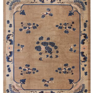 Beige field rug with blue and brown stylized phoenix corner designs and scattered motifs within a thick border.