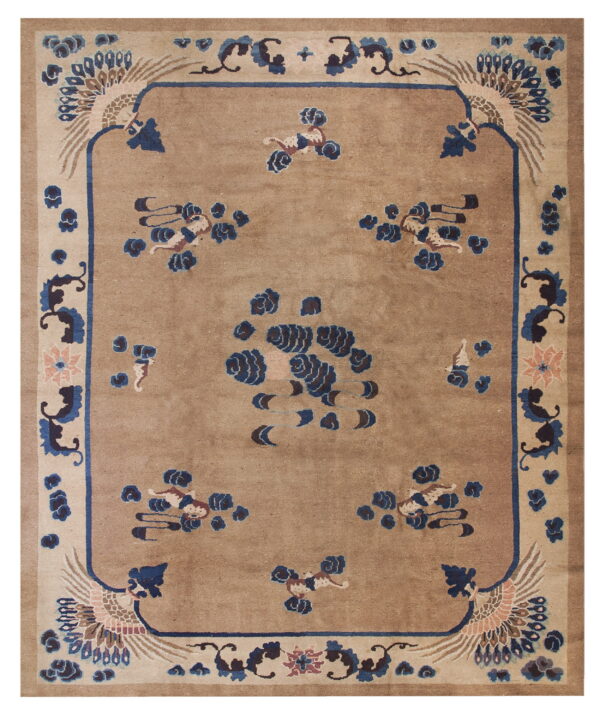 Beige field rug with blue and brown stylized phoenix corner designs and scattered motifs within a thick border.