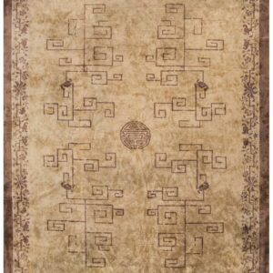 Beige area rug featuring dark brown Chinese key patterns, a central shou symbol, and a floral border.