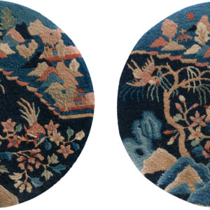 Round, high-pile rug with a complex navy blue, tan, and rose floral pattern and sculpted details.