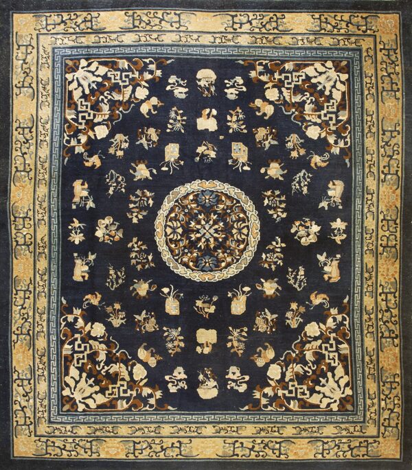 Navy blue rug with a central medallion and scattered traditional motifs in tan, cream, and brown.
