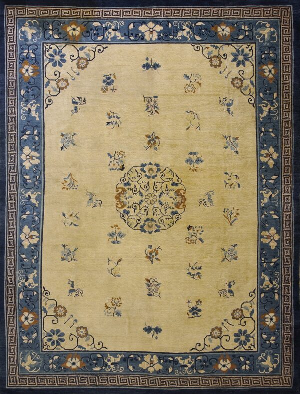 Yellow-beige rug featuring a central medallion and scattered blue floral designs within layered blue and navy borders.