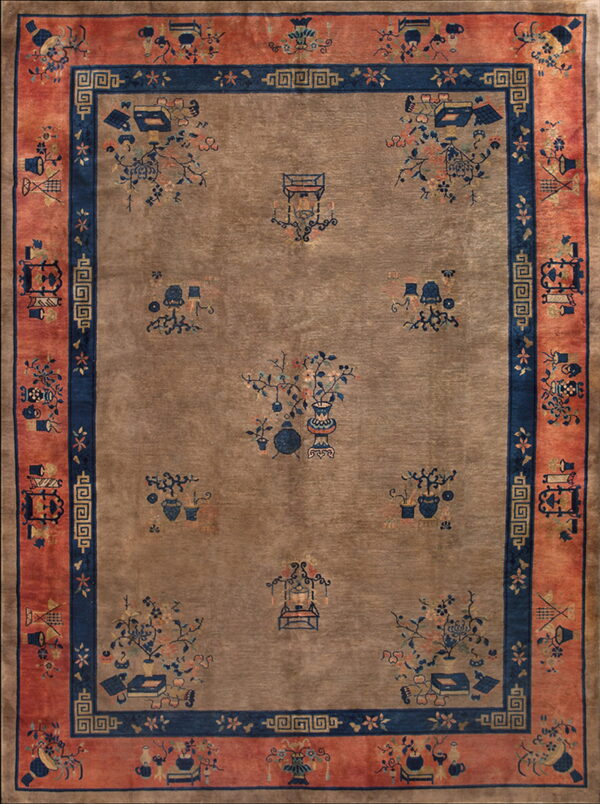 Taupe rug with scattered navy and peach motifs, bordered by dark blue and wide coral panels.