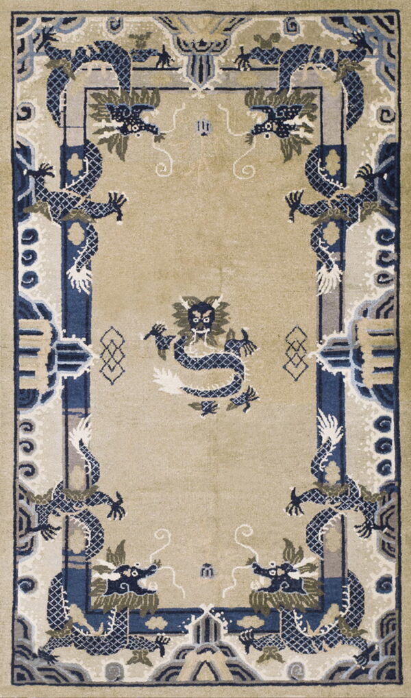 A beige rug with stylized blue and gray dragon motifs surrounding a central dragon design.