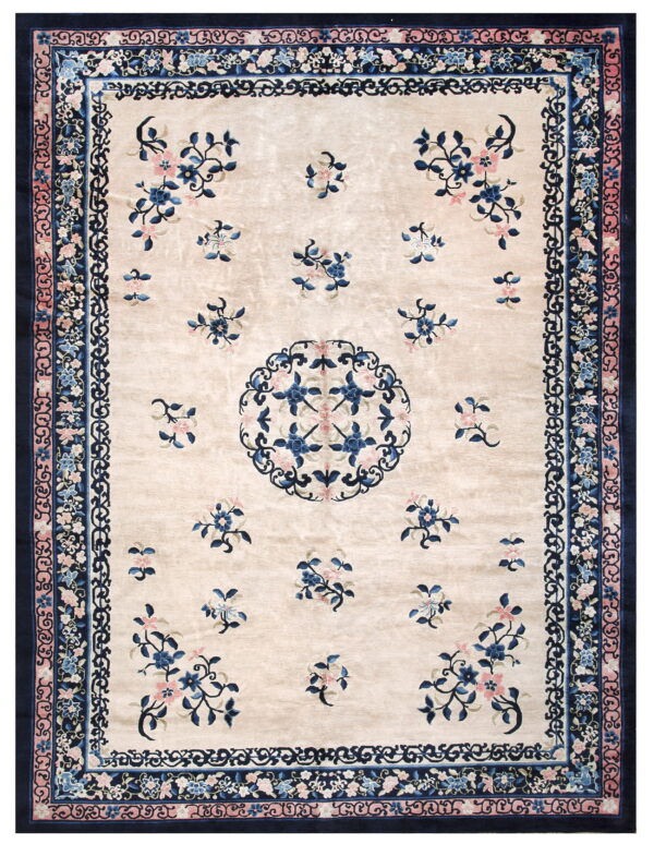 Ivory high-sheen rug featuring scattered blue and pink floral motifs and complex navy blue multi-layered borders.
