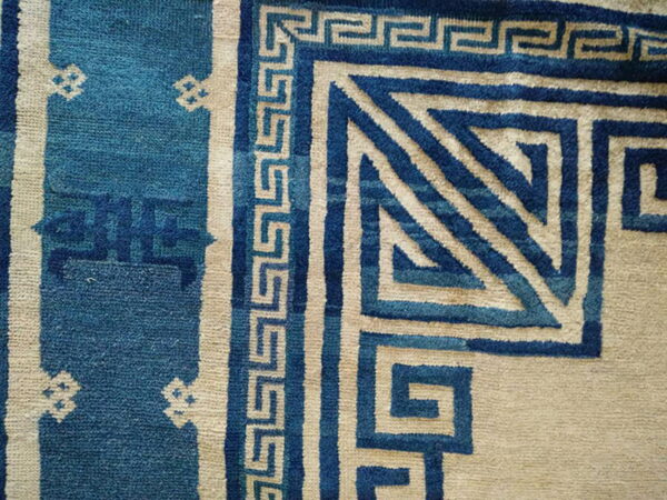Antique chinese - peking chinese knotted rug 2 The rug features a bold blue and beige greek key border with detailed geometric corner designs.