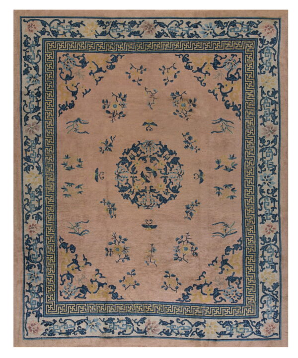 Mauve rug with a dark blue greek key border and a central floral medallion pattern.