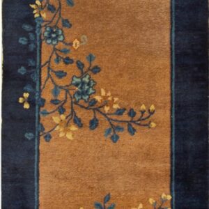Brown runner rug with a dark blue border and stylized yellow and blue floral designs.