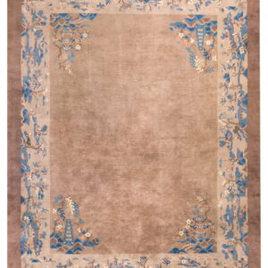 Luminous tan rug with a scenic border featuring blue, brown, and light-colored pagodas and trees.