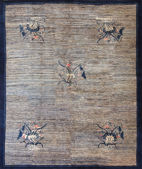 Navy-bordered rug featuring a striped blue and tan field with five scattered botanical medallion designs.