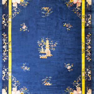 Plush cobalt blue rug featuring a central landscape pattern and surrounded by a striking yellow border.